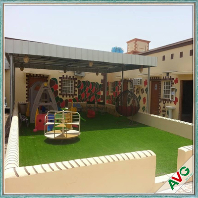 Chiny Warm Green Color Soft Hand feeling but Strong Dence Turf Surface for Play Ground dostawca